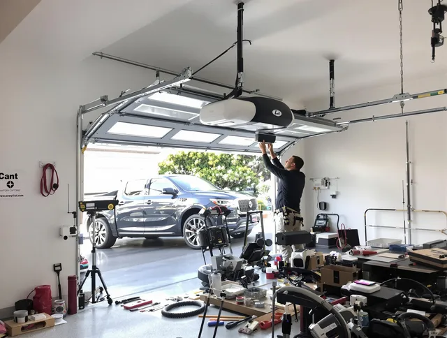 Kennesaw Garage Door Repair specialist installing smart garage door opener system in Kennesaw home