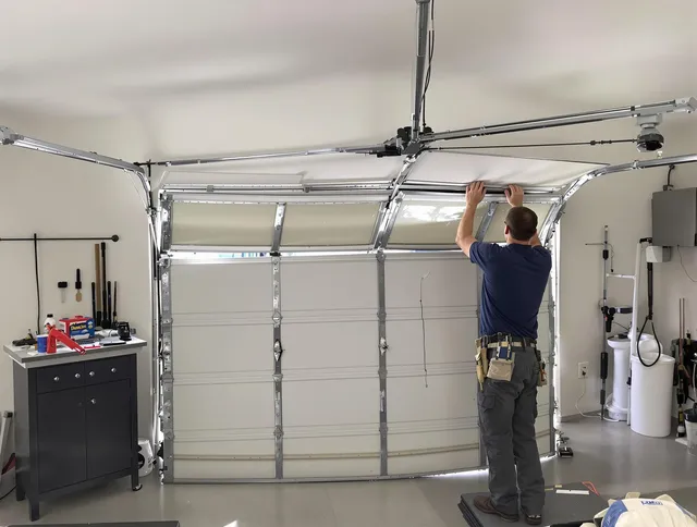 Kennesaw Garage Door Repair specialist performing precise section replacement on Kennesaw garage door